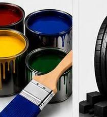 Cans of paint with a brush